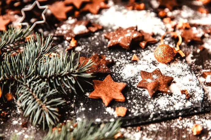Picture of flower one little holiday cookies next to a pine branch. Picture of flower one little holiday cookies next to a pine branch.